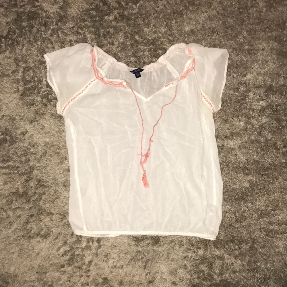 Flowy white shirt with millennial pink design